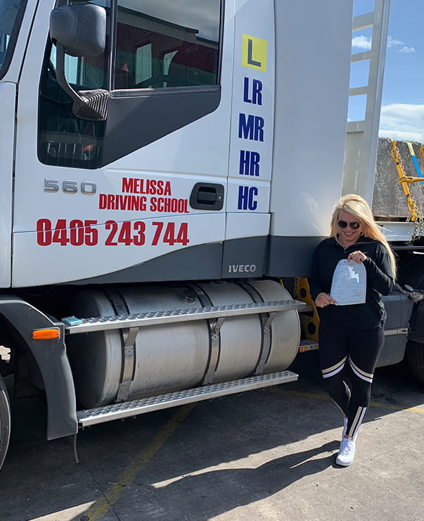 A girl after completing truck driving training in Liverpool